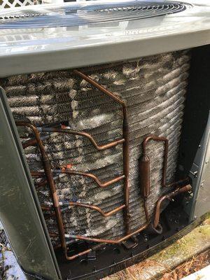 Condenser coil on outside air coditioning unit after maintenance cleaning.