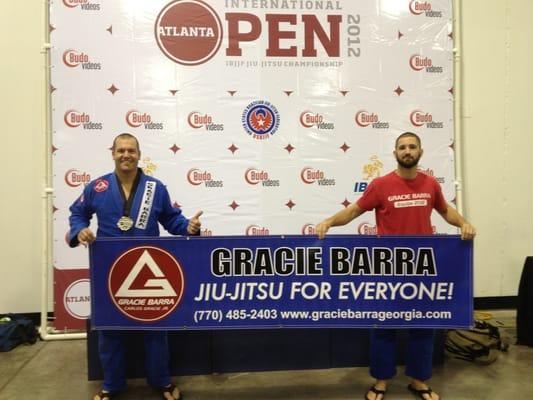 Me and my student after he won silver in the blue belt division.