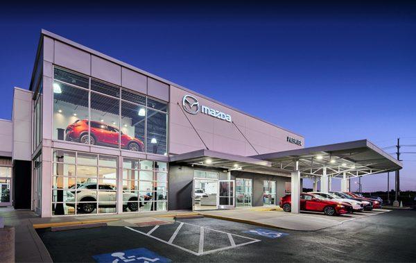 Dealership front entrance at twilight.