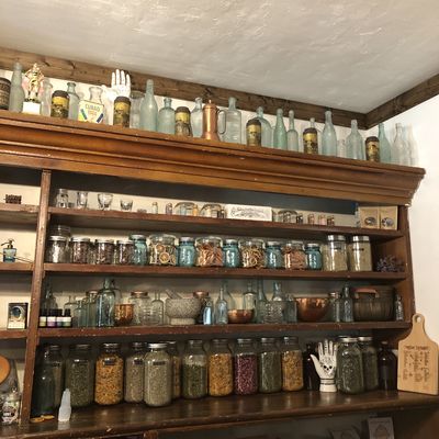 Behind the register is a personal apothecary.