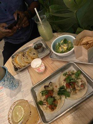 Quesadilla, guac and chips, cauliflower tacos, mezcal mule, watermelon mezcalita