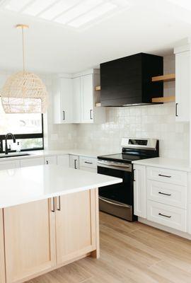 There is no better feeling than having custom made items for your home, like this White Oak Island, Black Vent Hood and Floating Shelves.