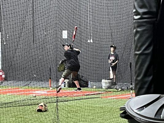 My oldest and youngest working on hitting in the cages!