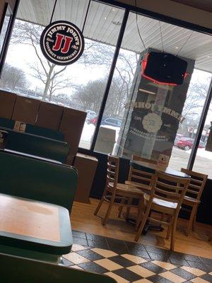 JJ logo, booths from inside