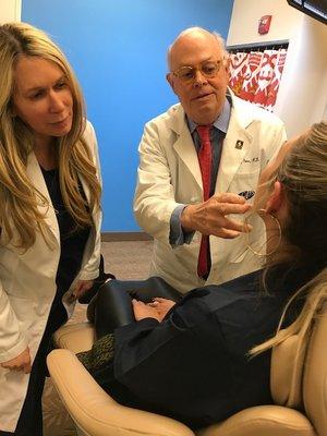 Cheryl Holly and Dr. Price consulting with a patient