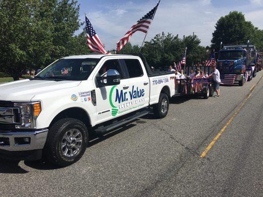 Mr. Value Electricians in the Cumming steam engine 4th of July Parade