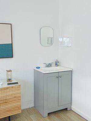 Cute sink vanity in studio.