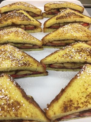 Delicious Challah French Toast Breakfast Platter with Nutella fresh strawberries and fresh bananas