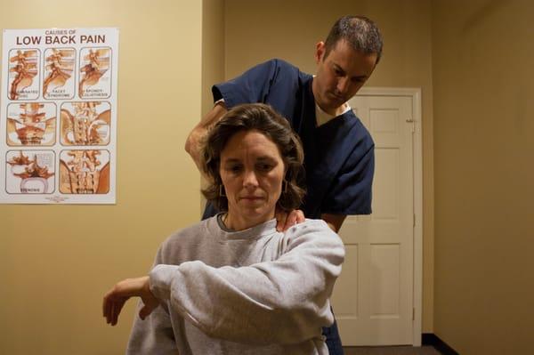 Garrett Lewellen, Doctor of Chiropractic performing Active Release Technique