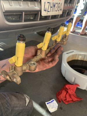 Fuel injectors being removed and replaced