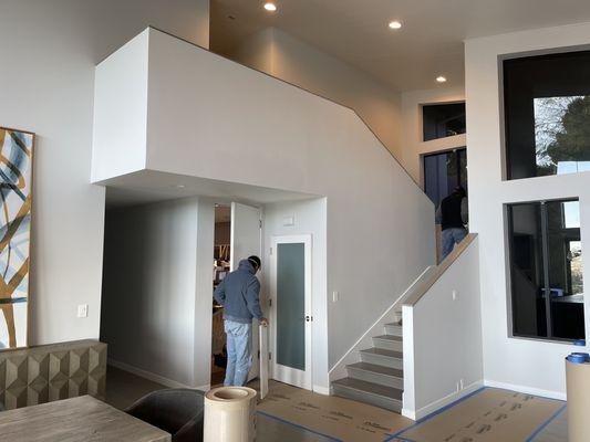 Staircase with walls prior to the work.