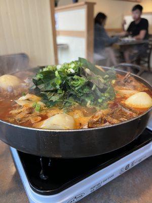 Spicy pork rib stew with potato in hot pot