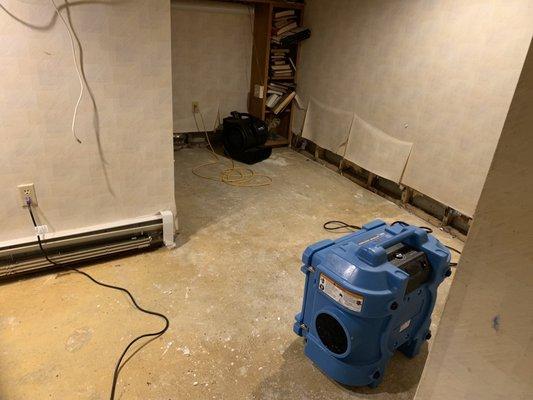 This home in Somerville, Ma had a pipe burst and basement floor