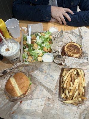 Top left, going clockwise: apple pie milkshake, Caesar salad, BLT, regular fries, Classic burger