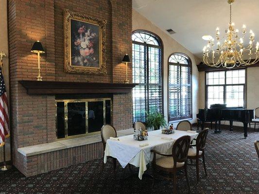 Assisted living dining room in fireplace .