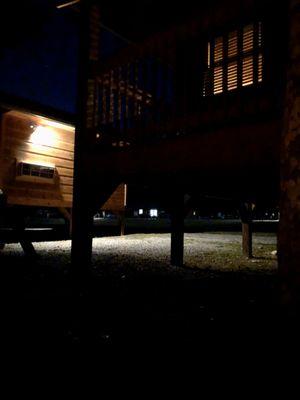 Sitting by the fire looking back at the cabin at night.