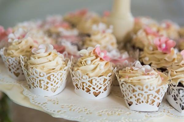 Decadent butter cream icing, candied pearls and fondant fleurette's in ivory and blush, sweetly wrapped in pearlized covers.