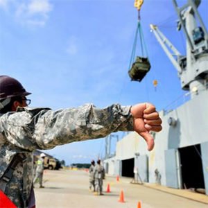 Signal Person / Rigger training available - Photo is of a person giving a hand signal to a crane operator