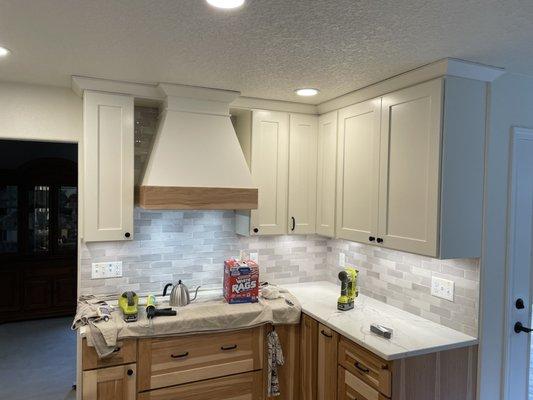 Natural hickory and painted white kitchen cabinets