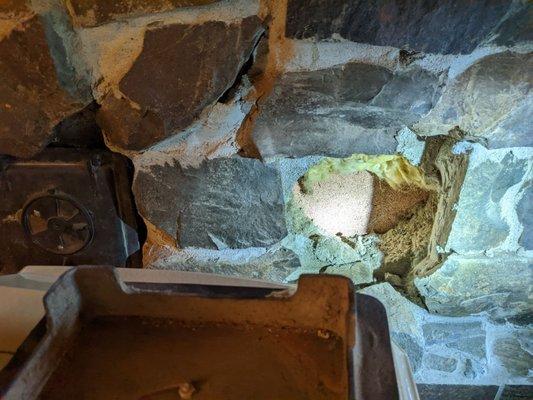 Non existent chimney access holes. The metal doors were just leaning against them, uninstalled and unattached.