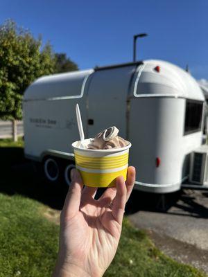 Chocolate vanilla swirl ice cream in a small cup