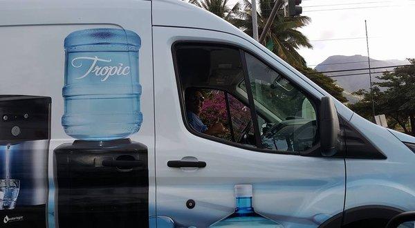 Friendly Tropic Water Delivery Driver.