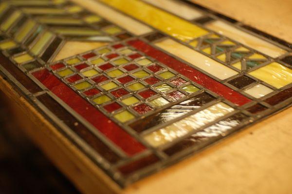 Closeup of a stained glass panel repair