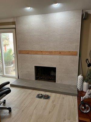 Still waiting for a mantle. Jeanette suggested a beautiful gray hearth with a 3D tile. Take a close look