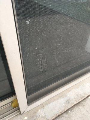 Tear in balcony screen door from previous tenants. Never repaired.