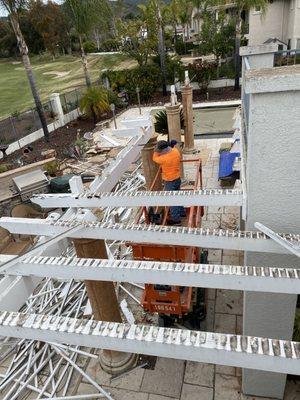 Demolition of patio overhang and columns .