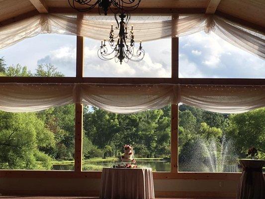 The wedding cake and view of the vineyard.