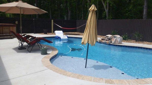 The finished pool by Blankenstein's, with custom tile work at bottom.