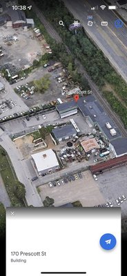 This industrial warehouse that looks like a dump is what Google Earth shows for the business address.