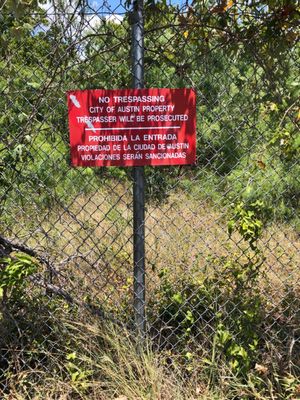 These signs are present all around the cemetery and the road leading in.