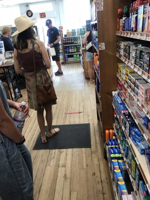 Customers waiting on line to pay