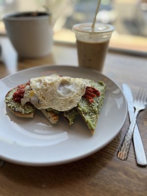 Avocado toast with fried egg and an iced latte