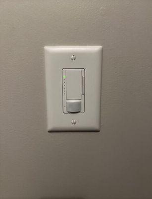 Dimmable motion detecting light switch installed in guest bath.