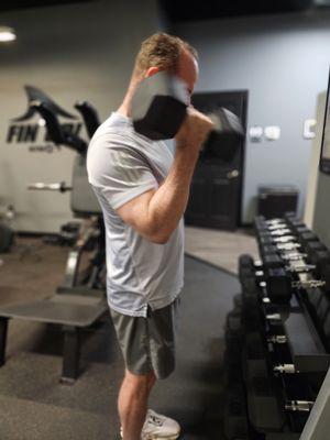 One of our amazing Ultra Fit clients John Phillips doing dumbbell curls!