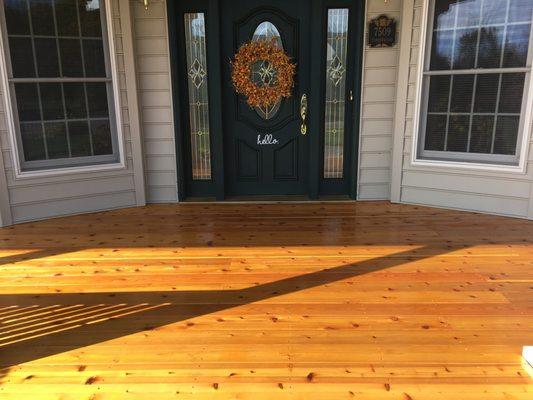 Existing Porch we removed old decking added 6 mil plastic and pea gravel to ground and installed new cedar 5/4 boards with two 2 coats stain