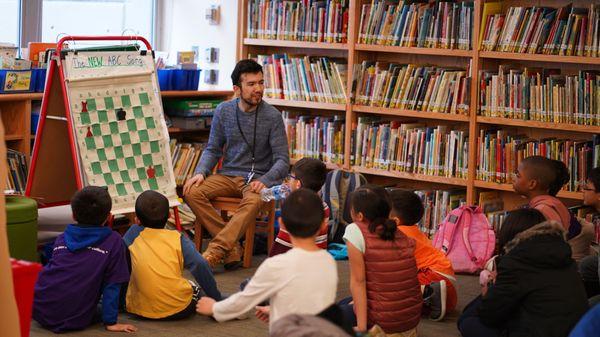 One of our chess masters with our future chess masters!