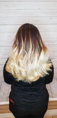 Chris worked magic ! Dark brown/red virgin hair into this beautiful blonde balayage/ombré.