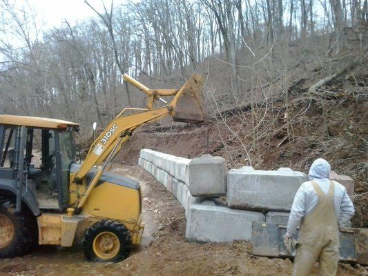 Building a retaining wall for flood victim