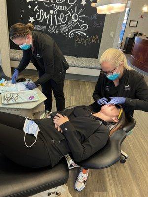 Dr. Lindsey and Sara placing braces!