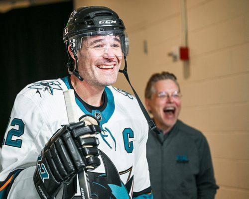 Dean capturing the joy of a proud father during the Sharks Legends Game honoring former San Jose Sharks forward Patrick Marleau (12).