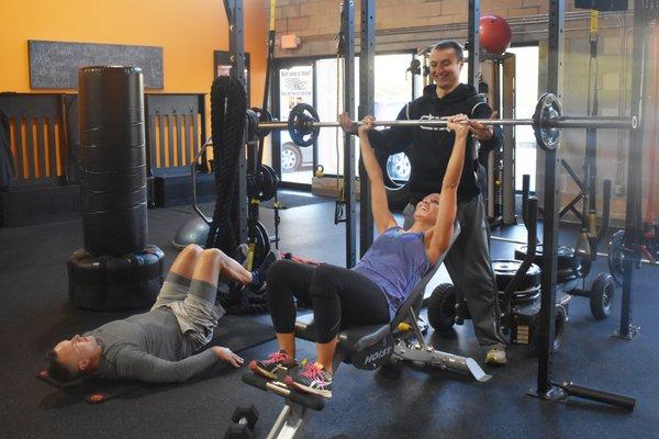 Group workouts at Revolution Fitness still allow for personalized attention from a trainer.