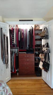 This reach-in closet was only 23 inches deep. We added grid panels to the backs of the doors for extra hanging space.