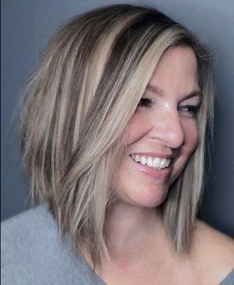 Fun change from a long layered cut to a modern soft textured lob that encourages lots of versatility and style.