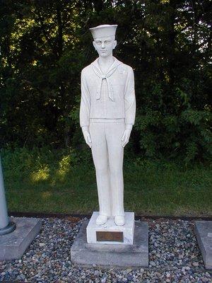 A United States Navy Military Man Statue.