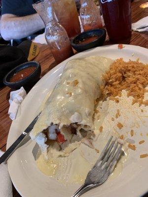 The insides of the seafood burrito!  This burrito is tasty and very cheesy!