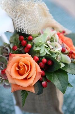 These flowers lined the aisle in a cute burlap sack.